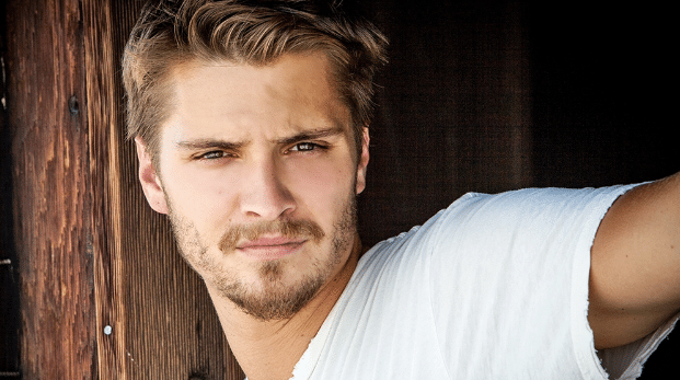 Luke Grimes As Elliott Grey